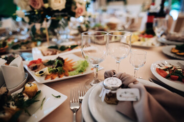 Fototapeta premium Empty wine glasses on the holiday table. Table with food