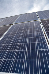 economical newly installed shiny solar panels that sparkle under the sky and the sun's rays.