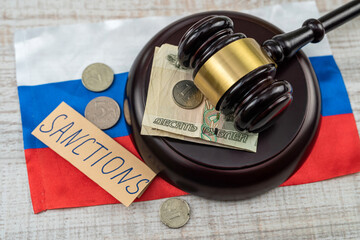 law wooden hammer with russian ruble sanction for country aggressor terrorist