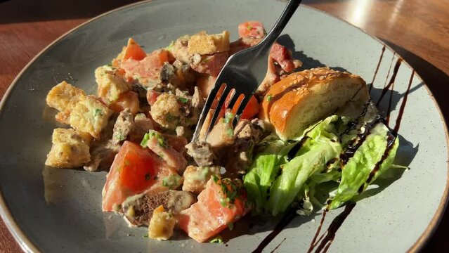 Hot beef liver salad with tomato sauce. High quality 4k footage