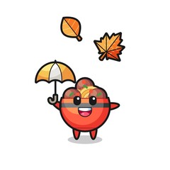 cartoon of the cute meatball bowl holding an umbrella in autumn