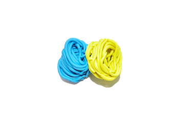yellow-blue plasticine on a white background