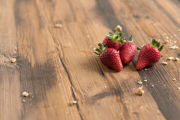 fresh strawberries on old wood table with copy space