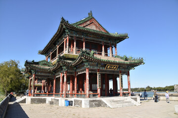 Naklejka premium Chinese Buddhist Temple on a Lake in Beijing, China