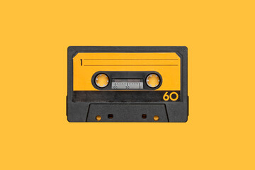 VINTAGE CASSETTE AUDIO TAPE LOOP ISOLATED ON ORANGE BACKGROUND.