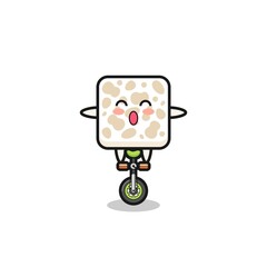 The cute tempeh character is riding a circus bike