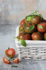 Tomatoes in white basket, smooth round tomato, italian food, close-up, concept of healthy eating, healthy food, mediterranean diet.