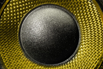 Yellow sound speaker woofer, close up