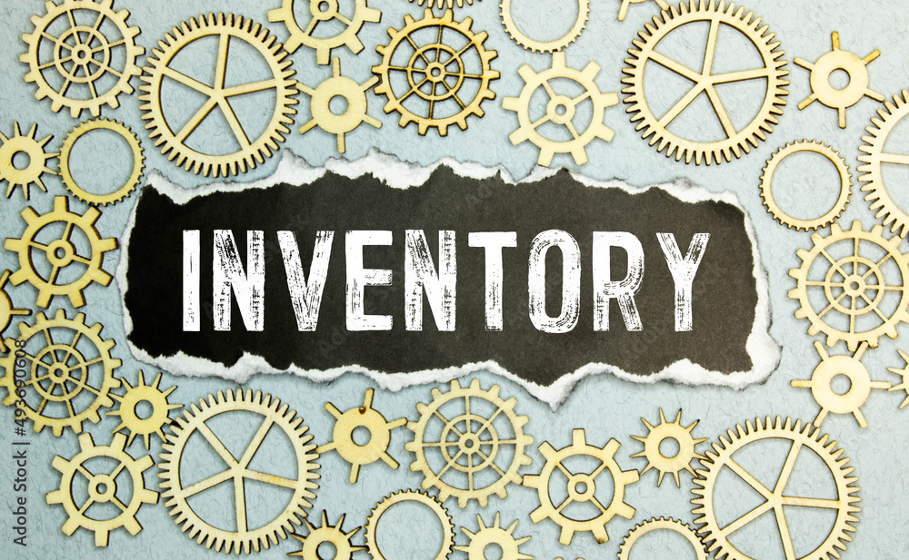 Poster inventory control text written on notebook with chart,calculator and dollars