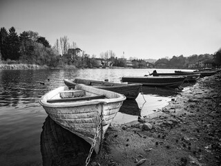 Old boat om adda river in Lombardy - obrazy, fototapety, plakaty