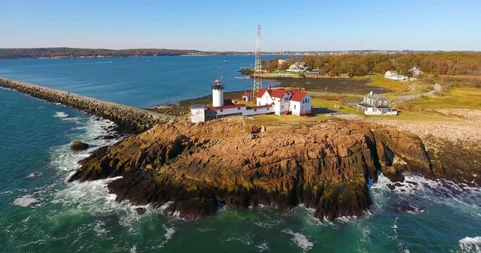 Aerial view of Eastern Point Lighthouse and Gloucester Harbor, Cape Ann, northeastern Massachusetts MA, USA. This historic lighthouse was built in 1832 on the Gloucester Harbor entrance.