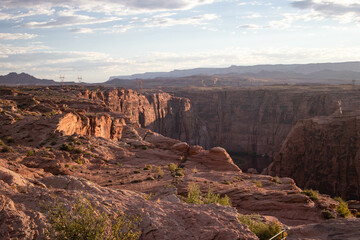 Sunset at Glen Canyon, Arizona, overlooking rock formations an powerlines from the nearby hydroelectric dam.