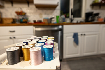 organized sewing thread in a white kitchen