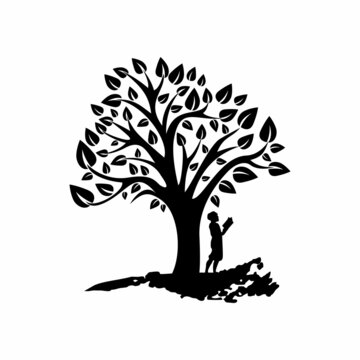 Silhouette of a child reading a book under a tree