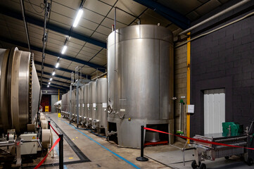 Naklejka na ściany i meble Production of sweet cassis creme liquor from ripe black currant berries, distillation and maceration in steel tanks, Burgundy, France