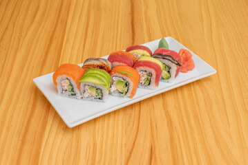 Rainbow roll is uramaki sushi roll stuffed with cucumber, avocado and crab sticks. It is prepared with various types of fish, most commonly tuna, salmon, white fish, horse mackerel, snapper, and eel