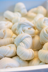 White soft braid cheese on market display