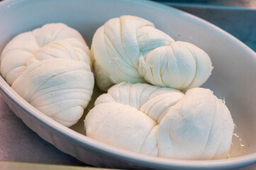 White soft braid cheese on market display