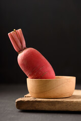 Organic radish from Thai farmer  local market on black background