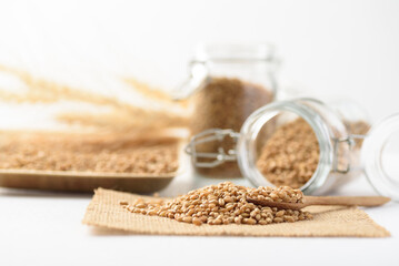 Whole wheat seedl on white background. Natural product, healthy baking ingredient