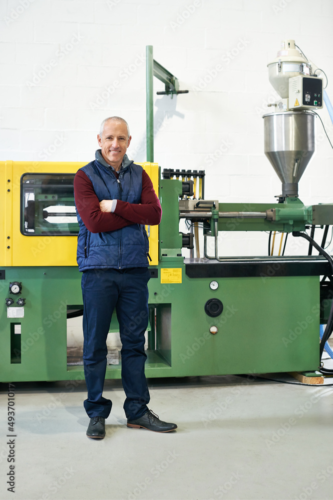 Canvas Prints This factory is a well-oiled machine. Full length portrait of a mature man standing next to machinery in a factory.