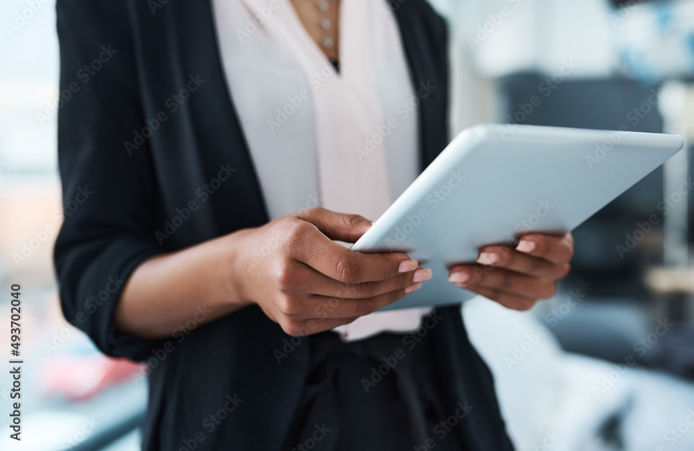 Poster technology is the way of the future. closeup shot of an unrecognizable businesswoman using a tablet 