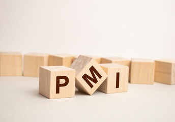 Wooden cubes with the letters PMI arranged in a vertical pyramid on banknotes, green plant in a flower pot on the background. PMI - short for Project Management Institute, business concept.