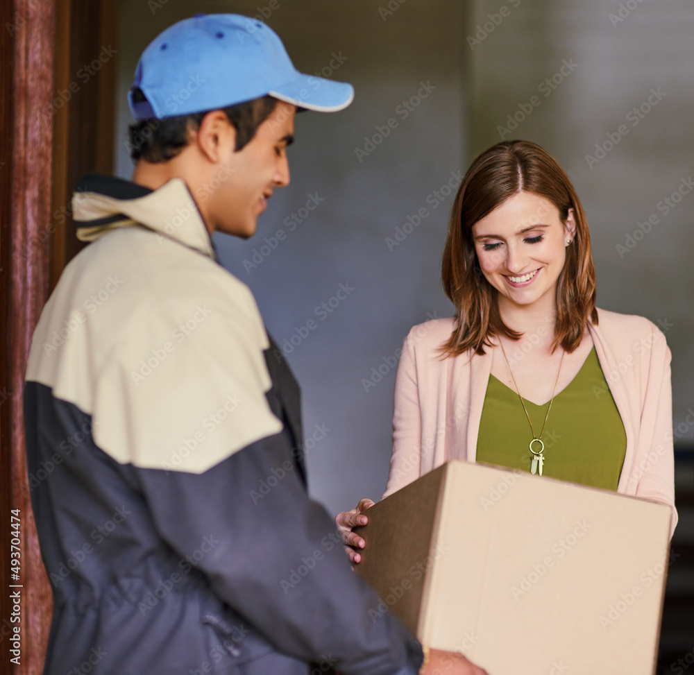 Poster Making another customer 100 satisfied. Cropped shot of a courier making a delivery to a customer at her home.