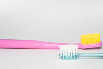 2 different toothbrush. Toothbrush closeup on white background.
