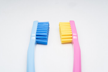 A conceptual of a couple toothbrush in love. Toothbrushes convey the human relationship between a man and a woman.