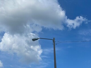 lamp post against blue sky