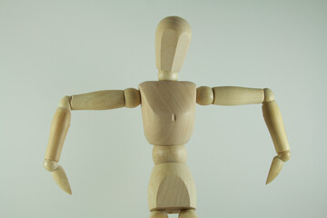 Wooden mannequin figure hand to head - body language bad idea.