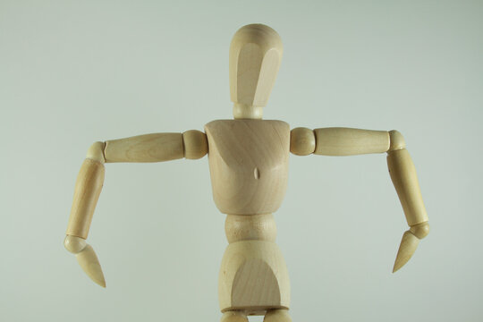 Wooden mannequin figure hand to head - body language bad idea.