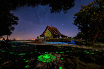 Long exposure Photograph with grain. Wat sirintornwararam temple or wat ratchathani is a thai...