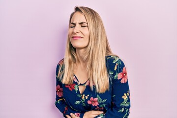 Young caucasian woman wearing casual clothes with hand on stomach because indigestion, painful illness feeling unwell. ache concept.