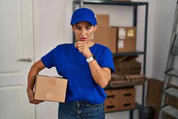 Middle age brunette woman working wearing delivery uniform and cap feeling unwell and coughing as symptom for cold or bronchitis. health care concept.