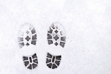 trail of shoes in the snow, tread in the snow.