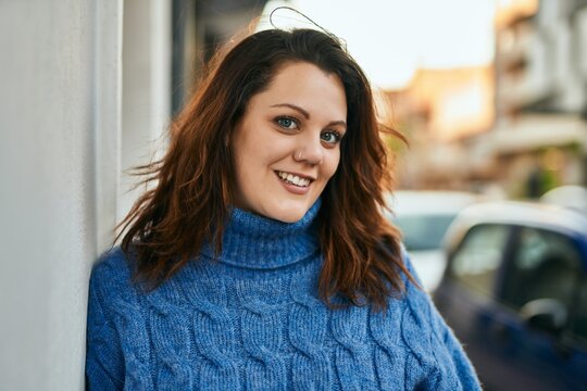 Young irish plus size girl smiling happy standing at the city.
