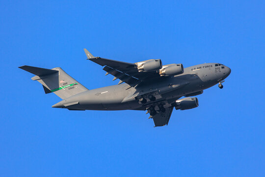 TOKYO, JAPAN - Mar 10, 2022: USAF C-17A Globemaster III military transport aircraft belonging to JB Lewis-McChord ,final approach at Yokota Air Base.