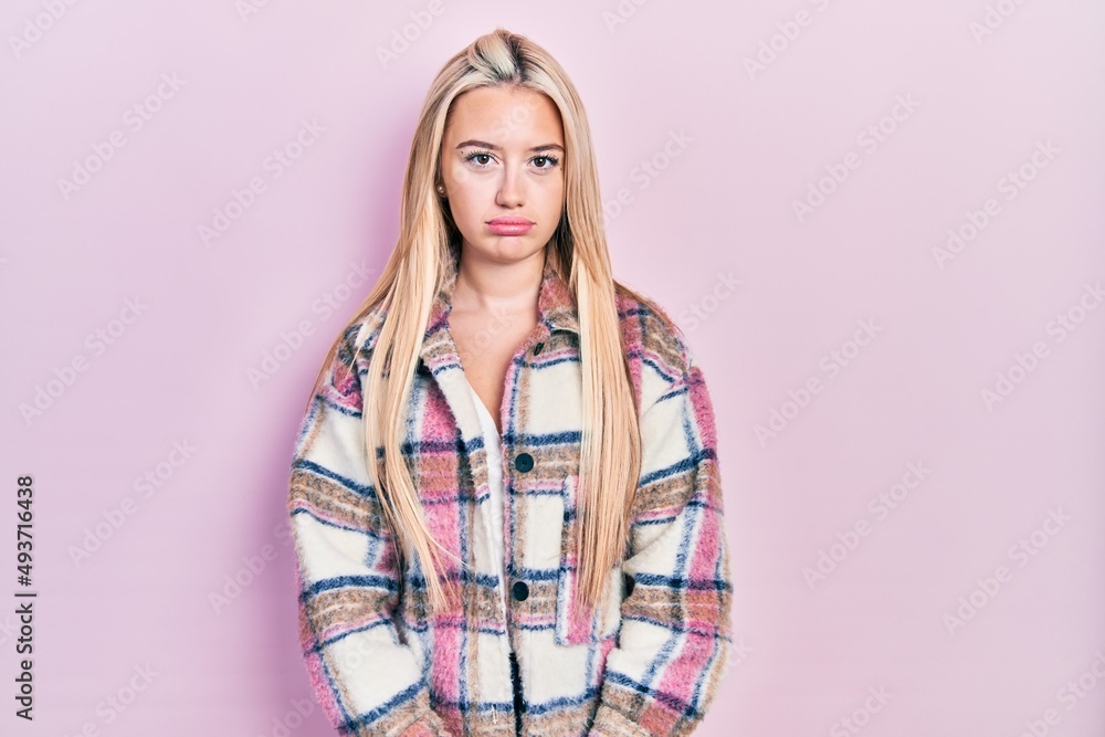 Wall mural young blonde girl wearing casual clothes depressed and worry for distress, crying angry and afraid. 