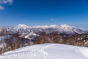 Obraz premium 飯縄山から雪の妙高戸隠連山を臨む