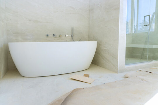 Construction Work Installing Ceramic Tile On Reconstruction Of Bathroom