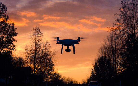 Drone flying in the sunset