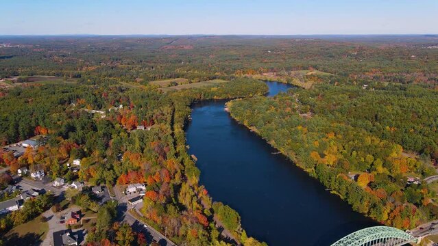 Merrimack River and Tyngsboro Bridge aerial view with fall foliage in downtown Tyngsborough, Massachusetts MA, USA.