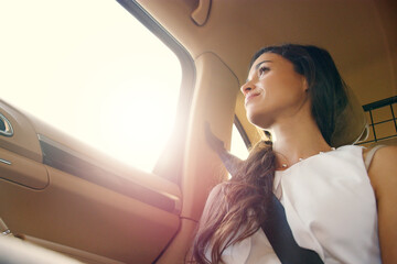 New possibilities awaken with every journey. Shot of an attractive young businesswoman sitting inside a car and looking out the window while travelling to work.