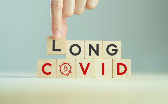 Long covid, post covid concept. Long-term effects of coronavirus. Chronic fatigue or weakness, feeling tired easily. Medical, treatment for long covid symstoms, tips for recovery..Wooden cube blocks.