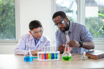 Students mixes chemicals in beakers. enthusiastic teacher explains chemistry to children, chemistry...