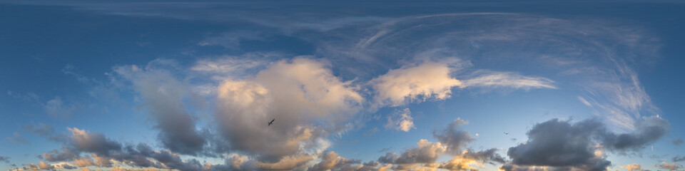 Dark blue sunset sky panorama with Cumulus clouds. Seamless hdr pano in spherical equirectangular format. Complete zenith for 3D visualization, game and sky replacement for aerial drone 360 panoramas.