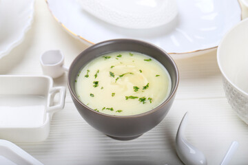 White Mushroom Cream Soup on Grey Bowl, Copy Space on White baackground for Advertisemen