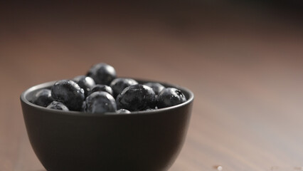 fresh washed blueberries in black bowl